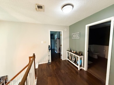 Take a look at this beautiful home located at the end of a on Diamondhead Country Club in Mississippi - for sale on GolfHomes.com, golf home, golf lot