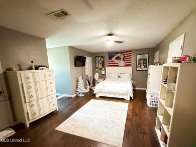 Take a look at this beautiful home located at the end of a on Diamondhead Country Club in Mississippi - for sale on GolfHomes.com, golf home, golf lot