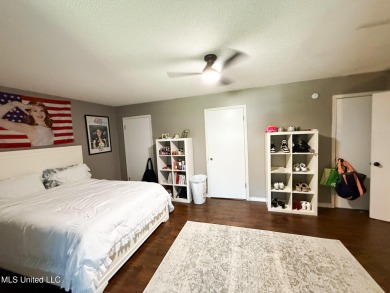 Take a look at this beautiful home located at the end of a on Diamondhead Country Club in Mississippi - for sale on GolfHomes.com, golf home, golf lot