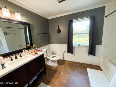 Take a look at this beautiful home located at the end of a on Diamondhead Country Club in Mississippi - for sale on GolfHomes.com, golf home, golf lot