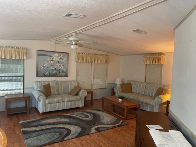 TIRED OF SNOW,ICE AND COLD, TRADE IT IN FOR SUN,WARM AND WHITE on Pine Lakes Country Club in Florida - for sale on GolfHomes.com, golf home, golf lot