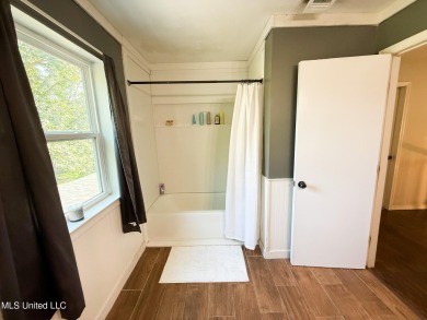 Take a look at this beautiful home located at the end of a on Diamondhead Country Club in Mississippi - for sale on GolfHomes.com, golf home, golf lot