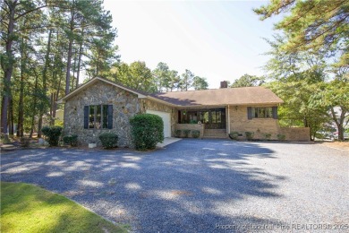 Welcome to this stunning 3-bedroom, 3-bath all-brick home on Woodlake Country Club in North Carolina - for sale on GolfHomes.com, golf home, golf lot