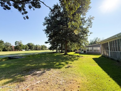 Take a look at this beautiful home located at the end of a on Diamondhead Country Club in Mississippi - for sale on GolfHomes.com, golf home, golf lot