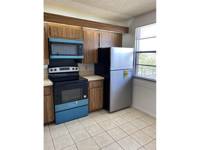 Large and bright condo. 2BR/2BA + extra large laundry room. All on Bear Lakes Country Club in Florida - for sale on GolfHomes.com, golf home, golf lot