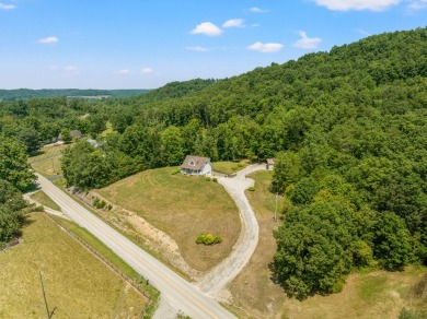 Welcome to this cozy Kentucky home neighboring the golf course! on Hickory Hills Country Club in Kentucky - for sale on GolfHomes.com, golf home, golf lot