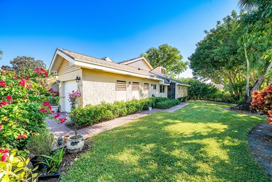 Enjoy comfortable South Florida living in this spacious 3-bed, 2 on Fountains Golf and Country Club in Florida - for sale on GolfHomes.com, golf home, golf lot