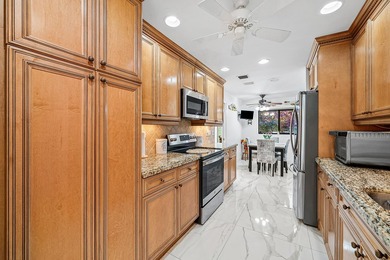 Enjoy comfortable South Florida living in this spacious 3-bed, 2 on Fountains Golf and Country Club in Florida - for sale on GolfHomes.com, golf home, golf lot