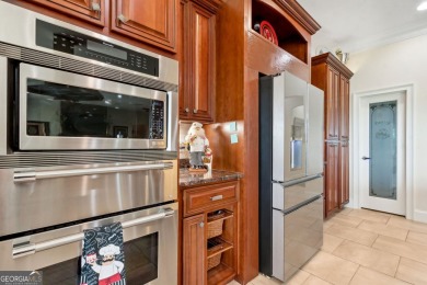 Enjoy serene views of the marsh and the golf course in this on The Club At Osprey Cove in Georgia - for sale on GolfHomes.com, golf home, golf lot
