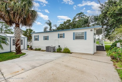 This charming park model home in The Great Outdoors RV  Golf on The Great Outdoors Golf and Country Club in Florida - for sale on GolfHomes.com, golf home, golf lot