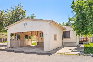 This well-maintained 4-bedroom, 2-bath double wide offers on Bill Roberts Municipal Golf Course in Montana - for sale on GolfHomes.com, golf home, golf lot