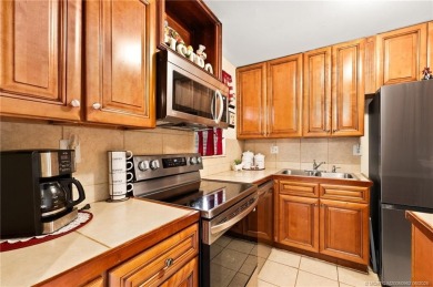 This cozy condo offers everything you need for Florida living on Monterey Yacht and Country Club in Florida - for sale on GolfHomes.com, golf home, golf lot