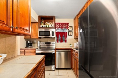 This cozy condo offers everything you need for Florida living on Monterey Yacht and Country Club in Florida - for sale on GolfHomes.com, golf home, golf lot