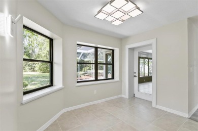 Light-Filled Designer Pool Home | New Roof | Gourmet Kitchen | on The Grand Club - Pine Lakes Course in Florida - for sale on GolfHomes.com, golf home, golf lot