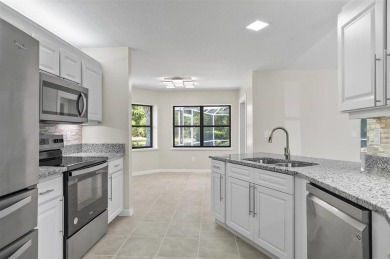 Light-Filled Designer Pool Home | New Roof | Gourmet Kitchen | on The Grand Club - Pine Lakes Course in Florida - for sale on GolfHomes.com, golf home, golf lot