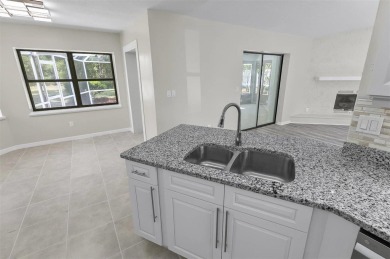 Light-Filled Designer Pool Home | New Roof | Gourmet Kitchen | on The Grand Club - Pine Lakes Course in Florida - for sale on GolfHomes.com, golf home, golf lot
