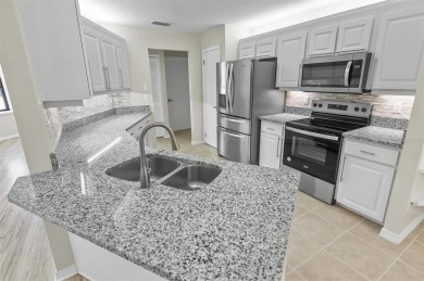 Light-Filled Designer Pool Home | New Roof | Gourmet Kitchen | on The Grand Club - Pine Lakes Course in Florida - for sale on GolfHomes.com, golf home, golf lot