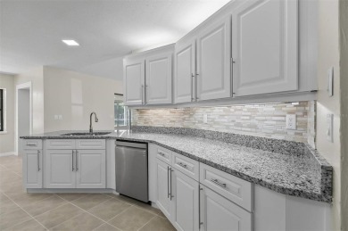 Light-Filled Designer Pool Home | New Roof | Gourmet Kitchen | on The Grand Club - Pine Lakes Course in Florida - for sale on GolfHomes.com, golf home, golf lot