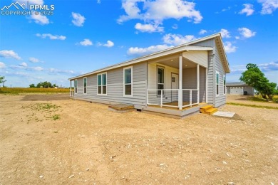 Experience modern country living with breathtaking mountain on Hollydot Golf Course in Colorado - for sale on GolfHomes.com, golf home, golf lot