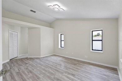 Light-Filled Designer Pool Home | New Roof | Gourmet Kitchen | on The Grand Club - Pine Lakes Course in Florida - for sale on GolfHomes.com, golf home, golf lot