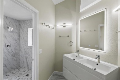 Light-Filled Designer Pool Home | New Roof | Gourmet Kitchen | on The Grand Club - Pine Lakes Course in Florida - for sale on GolfHomes.com, golf home, golf lot