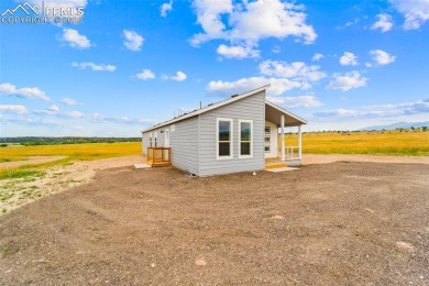 Experience modern country living with breathtaking mountain on Hollydot Golf Course in Colorado - for sale on GolfHomes.com, golf home, golf lot
