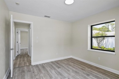 Light-Filled Designer Pool Home | New Roof | Gourmet Kitchen | on The Grand Club - Pine Lakes Course in Florida - for sale on GolfHomes.com, golf home, golf lot