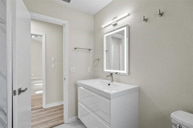 Light-Filled Designer Pool Home | New Roof | Gourmet Kitchen | on The Grand Club - Pine Lakes Course in Florida - for sale on GolfHomes.com, golf home, golf lot