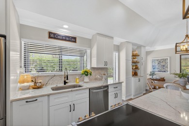 This beautifully renovated corner unit Villa has it all! on The Golf Club of Jupiter in Florida - for sale on GolfHomes.com, golf home, golf lot