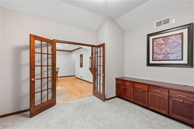 Set along the 14th hole in The Wilds, this executive two-story on The Wilds Golf Club in Minnesota - for sale on GolfHomes.com, golf home, golf lot