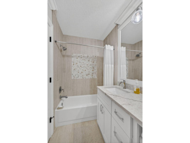 This beautifully renovated corner unit Villa has it all! on The Golf Club of Jupiter in Florida - for sale on GolfHomes.com, golf home, golf lot