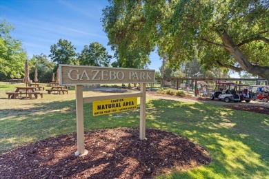 Welcome to this rare single-level end unit, perfectly positioned on Villages Golf and Country Club in California - for sale on GolfHomes.com, golf home, golf lot