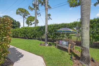 This beautifully renovated corner unit Villa has it all! on The Golf Club of Jupiter in Florida - for sale on GolfHomes.com, golf home, golf lot