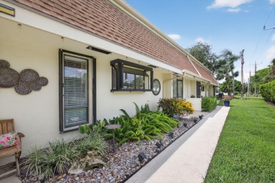 This beautifully renovated corner unit Villa has it all! on The Golf Club of Jupiter in Florida - for sale on GolfHomes.com, golf home, golf lot