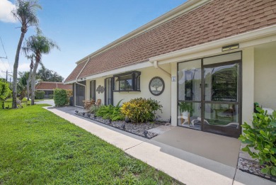 This beautifully renovated corner unit Villa has it all! on The Golf Club of Jupiter in Florida - for sale on GolfHomes.com, golf home, golf lot