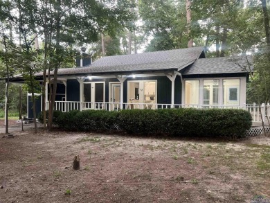 Nestled in a serene, wooded interior lot, this beautifully on Holly Lake Ranch Golf Club in Texas - for sale on GolfHomes.com, golf home, golf lot