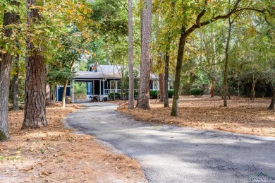 Nestled in a serene, wooded interior lot, this beautifully on Holly Lake Ranch Golf Club in Texas - for sale on GolfHomes.com, golf home, golf lot