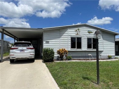Lovely home with new wood laminate flooring throughout & extra on Indianwood Golf and Country Club in Florida - for sale on GolfHomes.com, golf home, golf lot