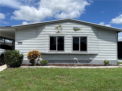 Lovely home with new wood laminate flooring throughout & extra on Indianwood Golf and Country Club in Florida - for sale on GolfHomes.com, golf home, golf lot