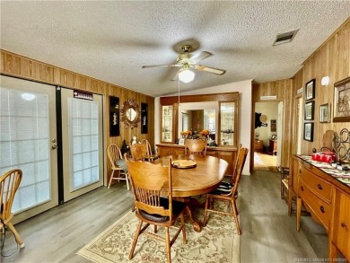 Lovely home with new wood laminate flooring throughout & extra on Indianwood Golf and Country Club in Florida - for sale on GolfHomes.com, golf home, golf lot