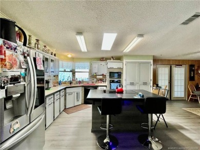 Lovely home with new wood laminate flooring throughout & extra on Indianwood Golf and Country Club in Florida - for sale on GolfHomes.com, golf home, golf lot