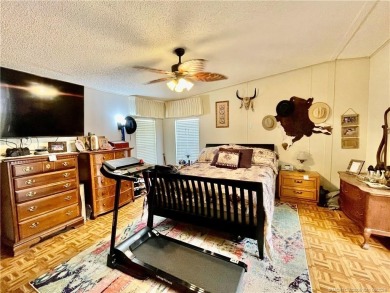 Lovely home with new wood laminate flooring throughout & extra on Indianwood Golf and Country Club in Florida - for sale on GolfHomes.com, golf home, golf lot