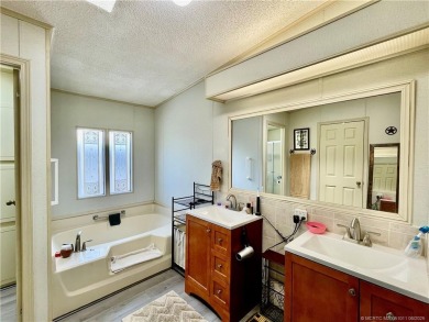Lovely home with new wood laminate flooring throughout & extra on Indianwood Golf and Country Club in Florida - for sale on GolfHomes.com, golf home, golf lot