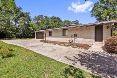 Lovely Golf Course Home with NO HOA FEES. You'll find Character on Rocky Bayou Country Club in Florida - for sale on GolfHomes.com, golf home, golf lot