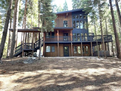 Welcome to your dream mountain escape! This stunning three-level on Lake Almanor West Golf Course in California - for sale on GolfHomes.com, golf home, golf lot