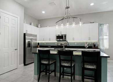 Beautifully appointed 2/2/2 home with a large den that can on Meadowood Golf and Tennis Club in Florida - for sale on GolfHomes.com, golf home, golf lot