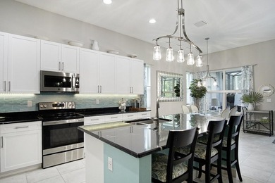 Beautifully appointed 2/2/2 home with a large den that can on Meadowood Golf and Tennis Club in Florida - for sale on GolfHomes.com, golf home, golf lot