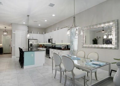 Beautifully appointed 2/2/2 home with a large den that can on Meadowood Golf and Tennis Club in Florida - for sale on GolfHomes.com, golf home, golf lot