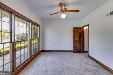 Stunning lake views in a gated community. This beautiful 3 on Fairfield Plantation Golf and Country Club in Georgia - for sale on GolfHomes.com, golf home, golf lot