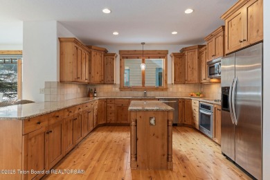 This well-designed Lupine model features an open-concept kitchen on Teton Springs Resort and Club in Idaho - for sale on GolfHomes.com, golf home, golf lot